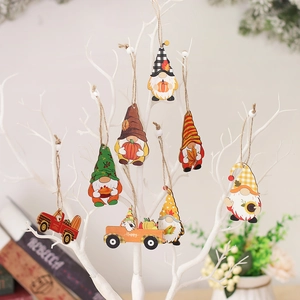 Set of 8 wooden harvest gnomes ornaments with pumpkins and sunflowers on a white tree