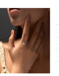 Close-up of S925 sterling silver chain ring featuring a sparkling zircon waterdrop pendant