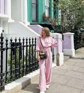 Pink casual long sleeve shirt and wide-leg trousers set shown in outdoor street style