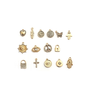 Collection of gold-plated alloy charms including heart and feather designs with rhinestones