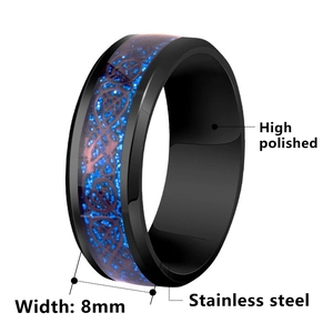 Polished 8mm black stainless steel ring with blue dragon pattern inlay on white background
