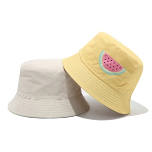 Kids reversible bucket hat set with yellow watermelon print and beige cotton canvas fabric