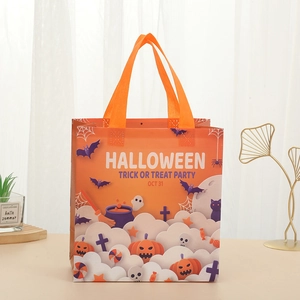 Orange non-woven Halloween gift bag with Trick or Treat print for party favors and candy