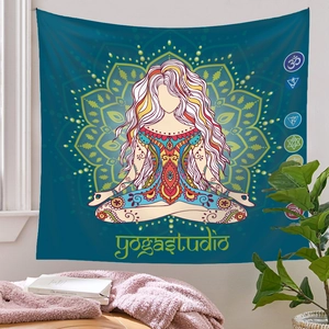 Detailed view of a teal yoga meditation tapestry with mandala patterns in a cozy room