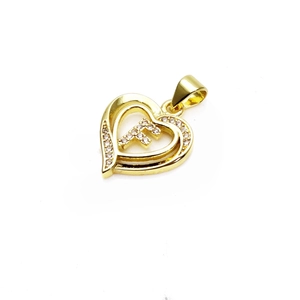 Detailed view of a gold heart-shaped pendant with letter F and inlaid cubic zirconia
