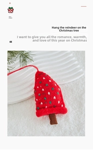 Close-up of red knitted Christmas tree ornament with white polka dots and hanging rope
