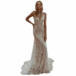 Elegant sleeveless mermaid wedding dress with lace patterns and deep V-neck backless design
