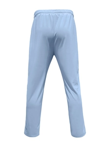 Detail of light blue sports pants featuring an elastic drawstring waistband on white background