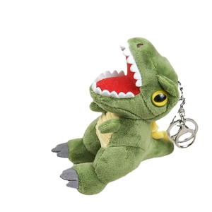 Green plush Tyrannosaurus Rex keychain with yellow belly and metal keyring on white background