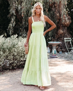 Detail of tiered lime green sundress with smocked bodice and vertical stripe texture
