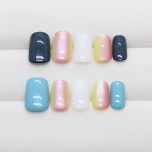 Colorful gradient press-on nails in blue, white, and yellow with high gloss finish