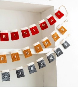 Detail of Christmas felt stocking banner with gold letters and sparkling sequins