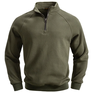 Detail of army green half-zip sweatshirt showing ribbed fabric texture and stand collar