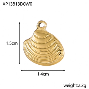Detailed view of a golden shell charm with dimensions 1.5cm by 1.4cm and wave texture