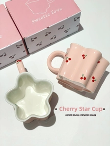 Detail of pink star-shaped ceramic cherry mugs with sweetie love gift box packaging