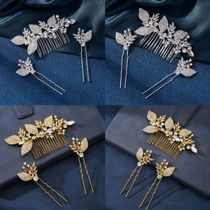 Detailed view of metal hair comb and clips with rhinestones in gold and silver finish