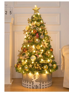 Detail of 60cm gold-themed mini Christmas tree with warm LED lights and festive ornaments