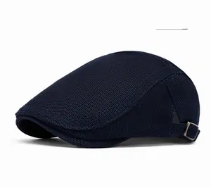 Detail of navy blue mesh ivy cap showing breathable texture and vintage metal buckle