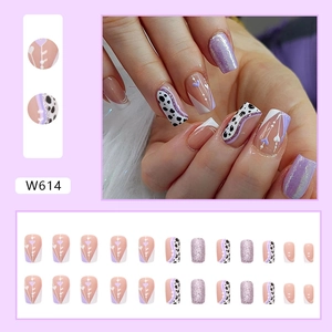 Pink heart cow print press-on nails with purple glitter and white details, W614 kit