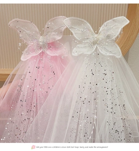 Close-up of pink bow hair clip with double-layer mesh, sequins and elegant pearl beads