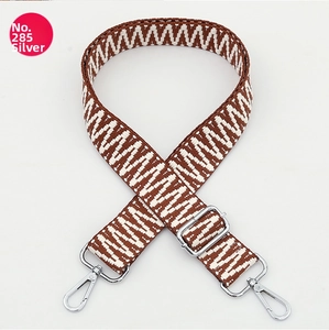 Adjustable wide replacement bag strap with silver metal hardware and geometric pattern