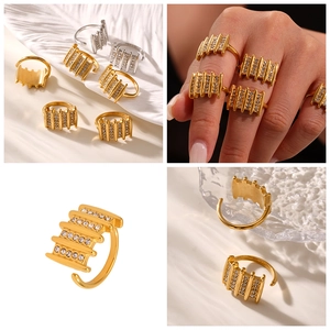 Macro detail of multi-row zircon geometric open ring in gold and silver finish