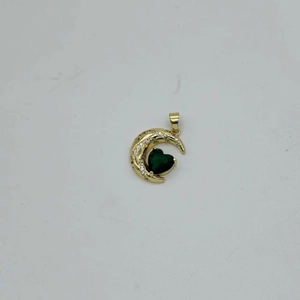 Detailed close-up of a golden moon pendant with green heart gemstone and white zircons