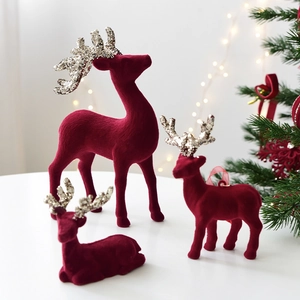 Burgundy flocked Christmas reindeer set with silver glitter antlers for holiday decor
