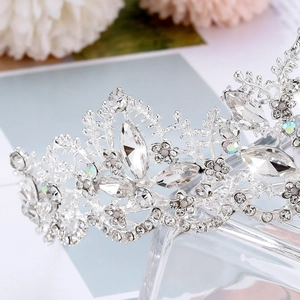 Macro shot of silver bridal crown featuring marquise crystals and metal floral textures