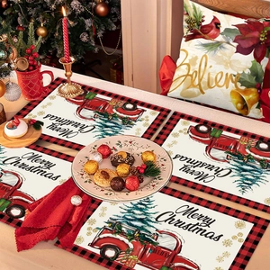 Christmas place mats set with red truck and tree design on festive table setting