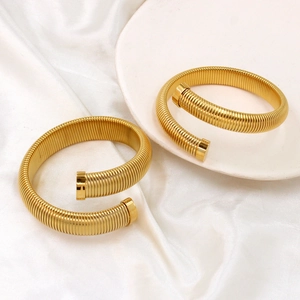 Elegant gold plated stainless steel spiral open bracelet with textured tubogas snake design