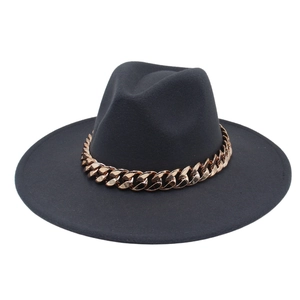 Detailed view of the wide brim fedora featuring a decorative rose gold cuban chain link