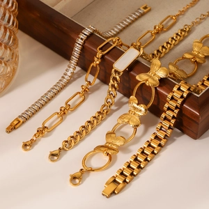 Gold stainless steel bracelet set with butterfly charms and zircon cuban links