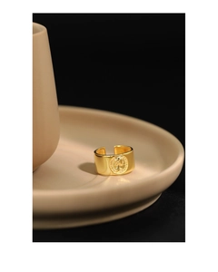 Detail of vintage gold open ring featuring a textured Queen Elizabeth coin portrait