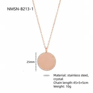 Detail of rose gold geometric round pendant with crystal inlay on stainless steel chain