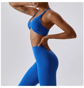 Detail shot of bright blue sports bra with twist back and high-waist yoga leggings set