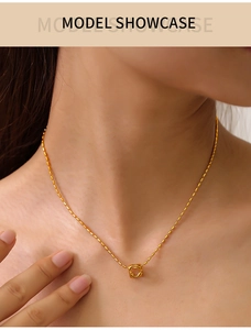 Close-up of a gold-plated titanium steel bead chain with a geometric hollow square pendant