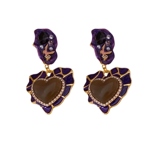 Vintage heart drop earrings with purple enamel and gold finish on white background
