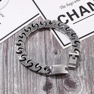 Vintage oxidized stainless steel bracelet with S-shaped interlocking links and buckle