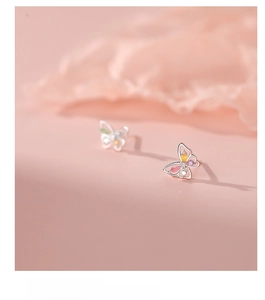 Macro view of 925 sterling silver butterfly studs with multi-color zircon inlay details