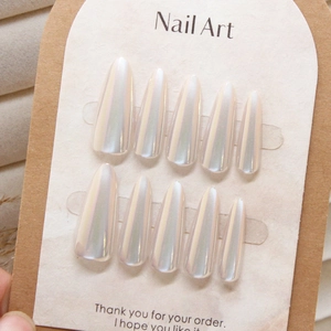 Iridescent pearl white long almond press-on nails set displayed on a showcase card