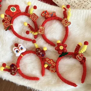 Set of four festive red plush Lunar New Year headbands with zodiac mascot decorations