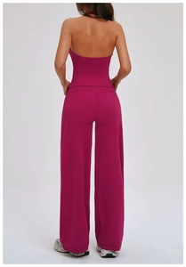 Detail showing the plum purple halter neck backless sports top and wide leg yoga pants