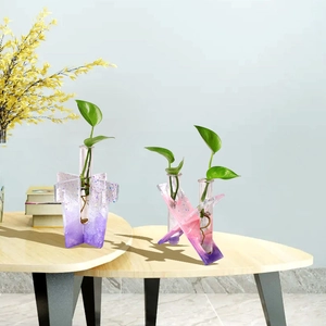 Detail of gradient resin base and glass tube for hydroponic plant vase propagation