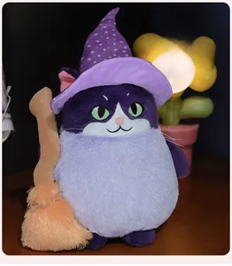 Detail of plush Halloween wizard cat with purple starry hat and orange broom stick