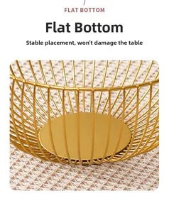 Close-up of the stable flat bottom design on this golden iron wire fruit basket
