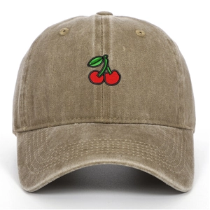 Close-up of red cherry embroidery on vintage washed cotton khaki baseball cap detail