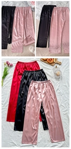 Detailed view of elastic waistband on satin pajamas with silky texture and smooth fabric