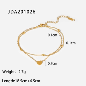 Detail of 18K gold heart pendant with layered oval bead chain including size specifications