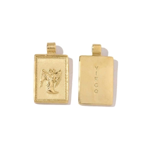 Close-up of golden rectangular Virgo zodiac pendant with detailed relief and engraving